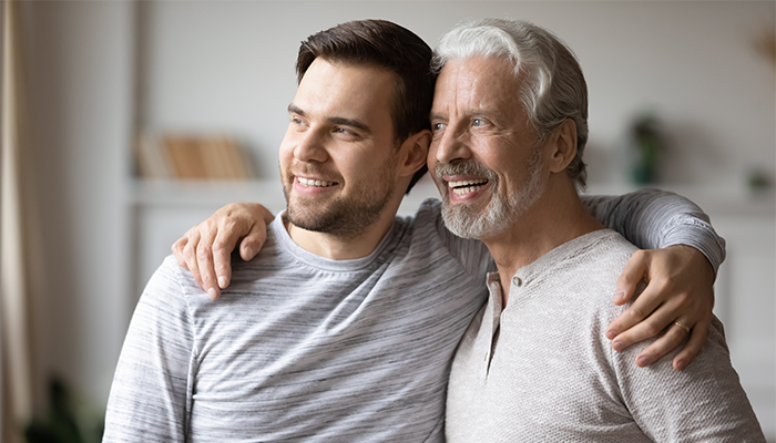 Head,Shot,Excited,Grown,Up,Son,Embracing,Shoulders,Of,Happy Ruggie Wealth Management Estate Planning